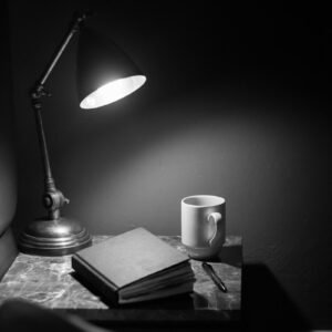 white ceramic mug on brown wooden table